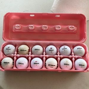 12 used Wilson golf balls.